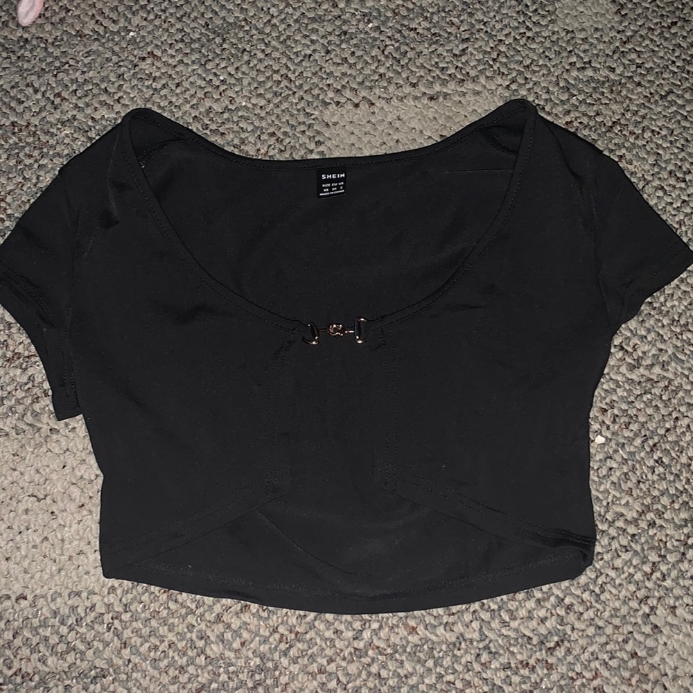 black crop top from Shein, with gold chain in middle.